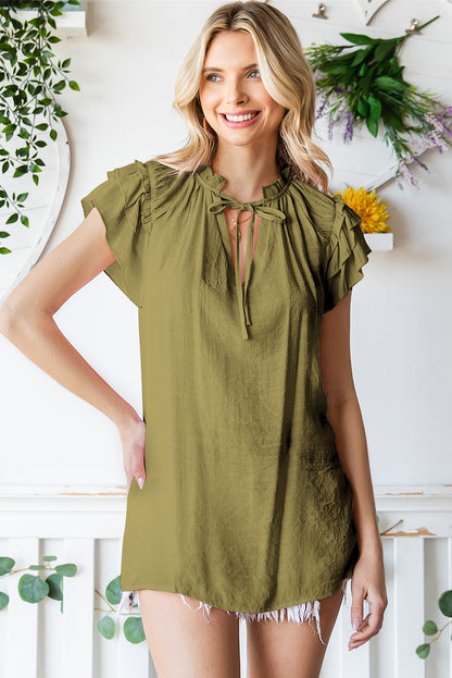 Blouse à manches flottantes et col noué