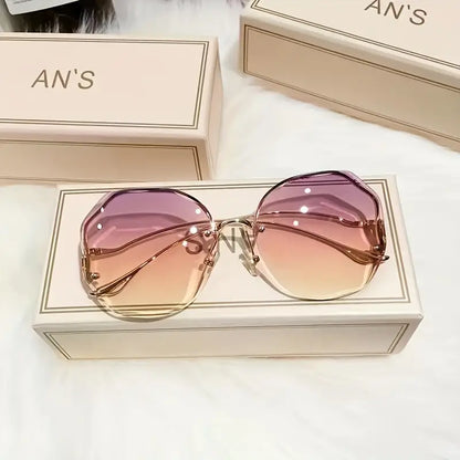 Stylish and Safe: Women's Rimless Cut Edge Sunglasses with UV Protection and Ocean Gradient Tea Pink Tint!