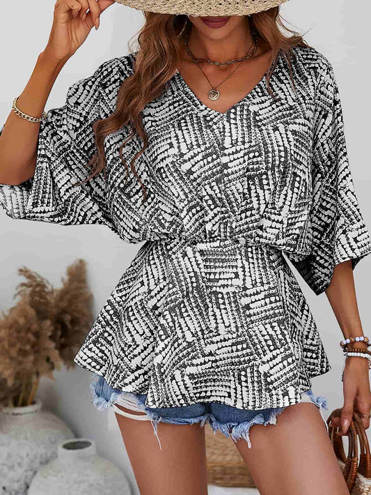 Blouse imprimée à col en V et manches chauve-souris