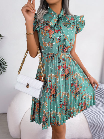 Robe plissée à imprimé floral et col noué, longueur aux genoux