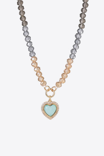 Collier de perles avec pendentif coeur