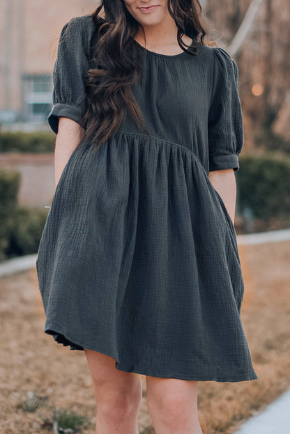 Vestido de manga abullonada con cuello redondo y bolsillos