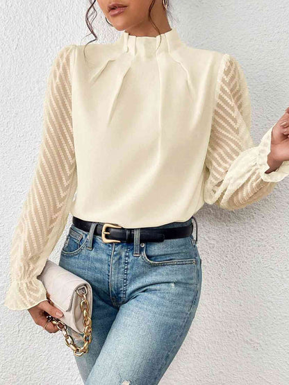 Blouse à manches volantées et col montant