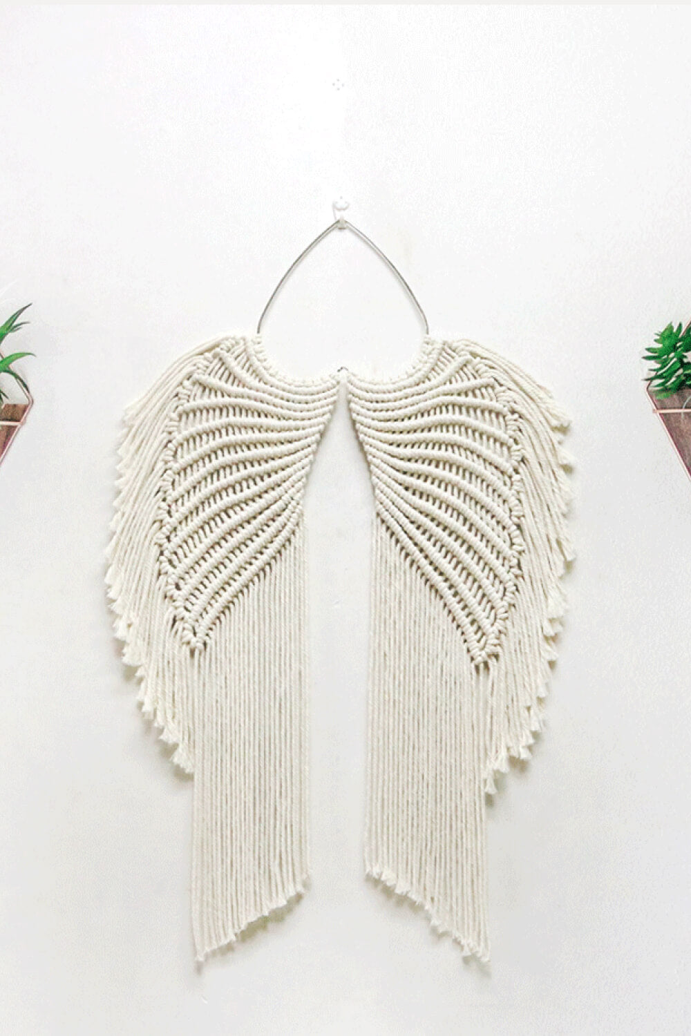 Colgante de pared con alas de ángel en macramé