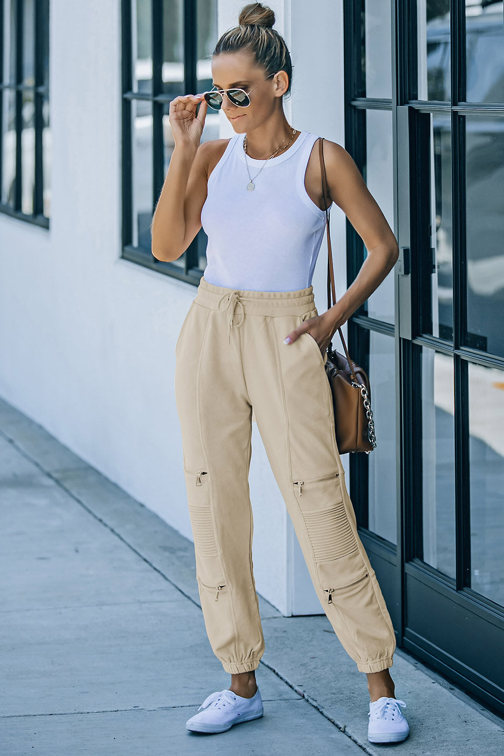 Pantalon de jogging avec cordon de serrage et poches à détail zippé à la taille