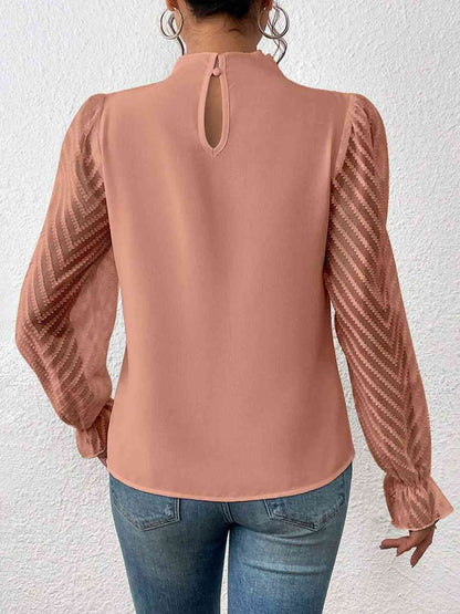 Blouse à manches volantées et col montant