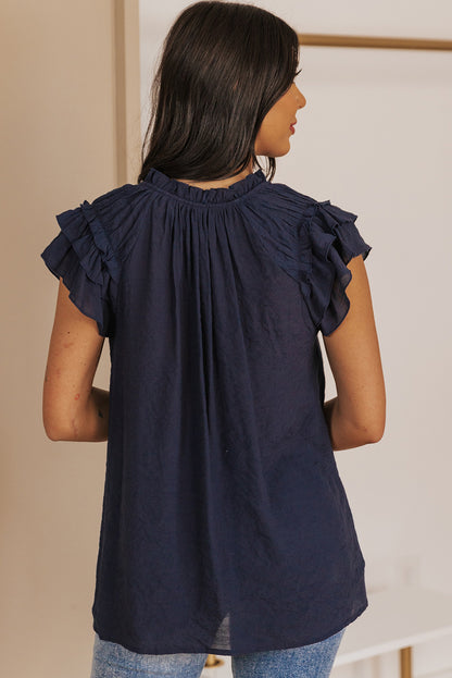 Blouse à manches flottantes et col noué