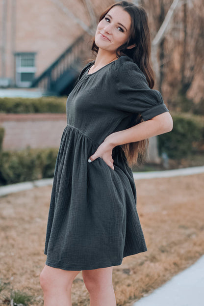 Vestido de manga abullonada con cuello redondo y bolsillos