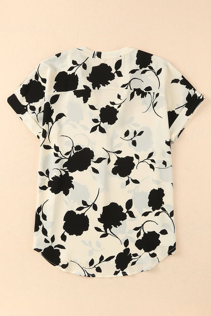 Blusa floral de manga corta con puños y cuello con muescas