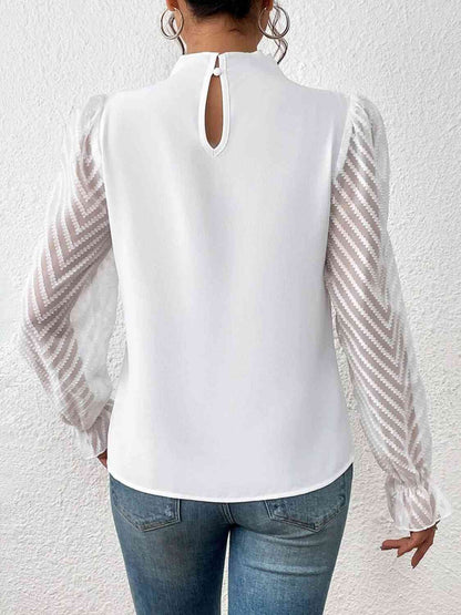 Blouse à manches volantées et col montant