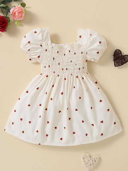 Vestido bebé niña con estampado de corazones y escote cuadrado