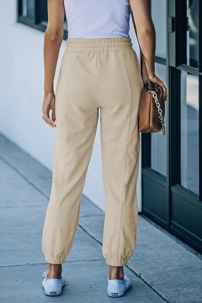 Pantalon de jogging avec cordon de serrage et poches à détail zippé à la taille